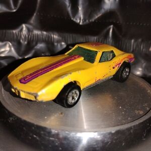 Vintage Yellow Hot Wheels with Purple Stripes